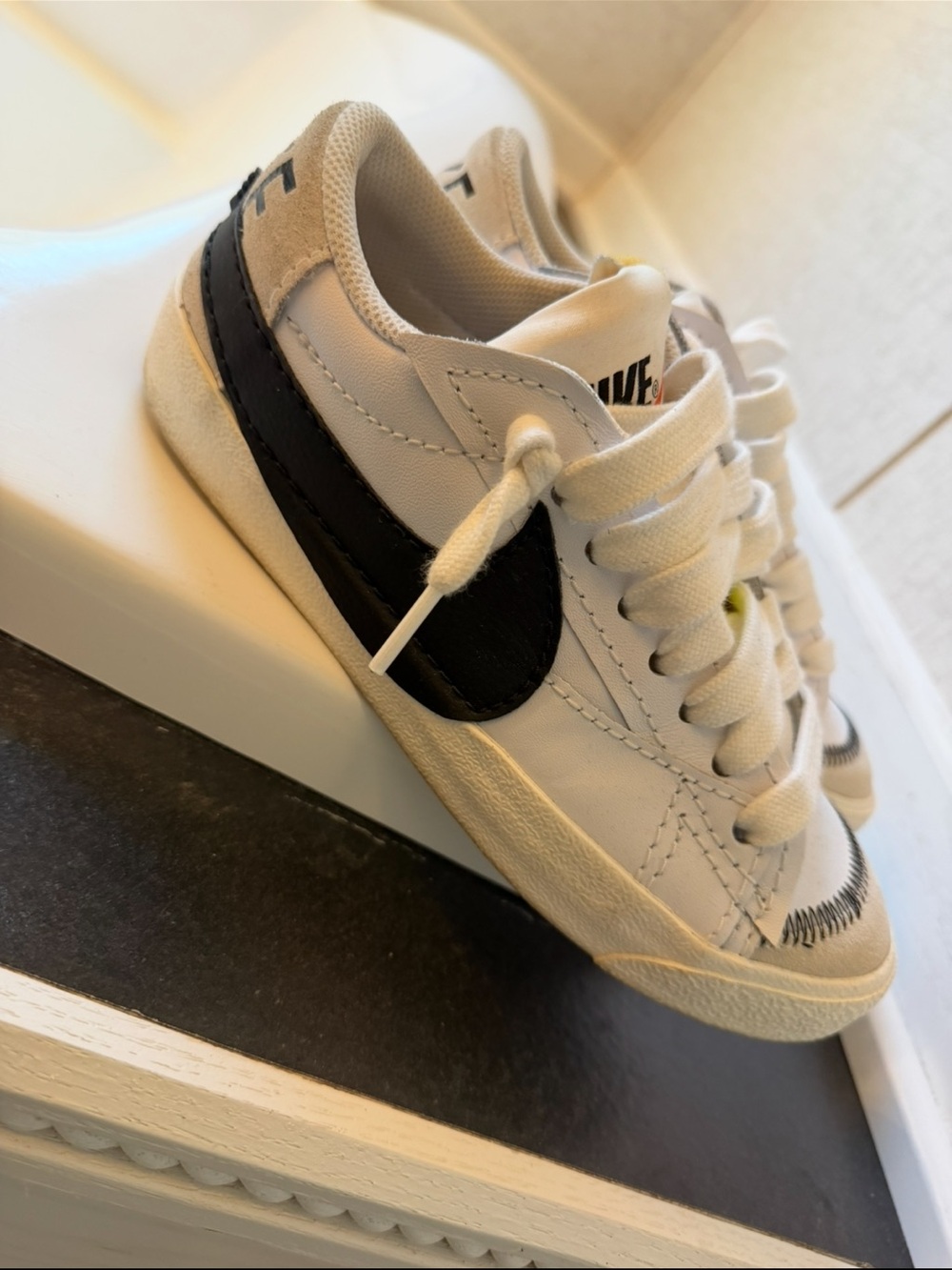 Nike Kids White Sneakers with Black Swoosh